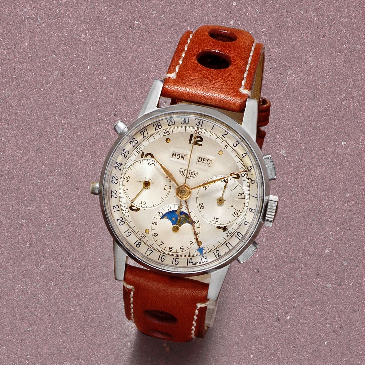 Heuer. A rare stainless steel manual wind triple calendar chronograph wristwatch with moon phase Circa 1955