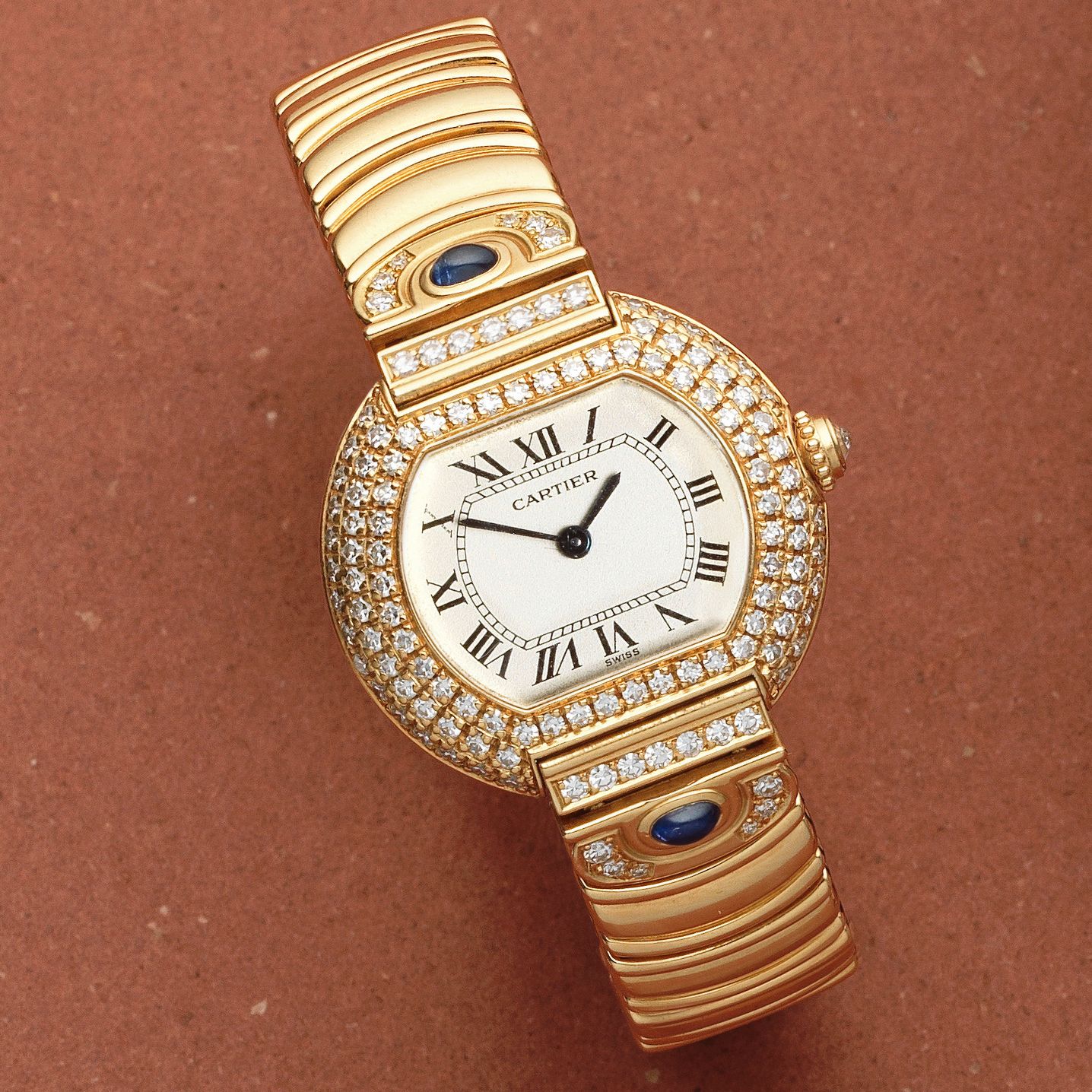 Cartier. A lady's 18K gold diamond set quartz bracelet watch Tortue, Circa 1990