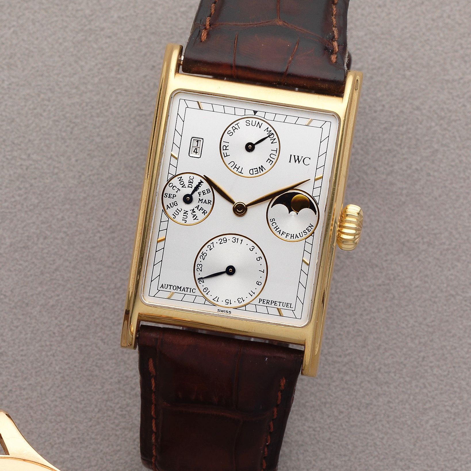 IWC. An 18K gold automatic perpetual calendar rectangular wristwatch with moon phase Novecento, Ref: 3546, Sold 22nd February 2000