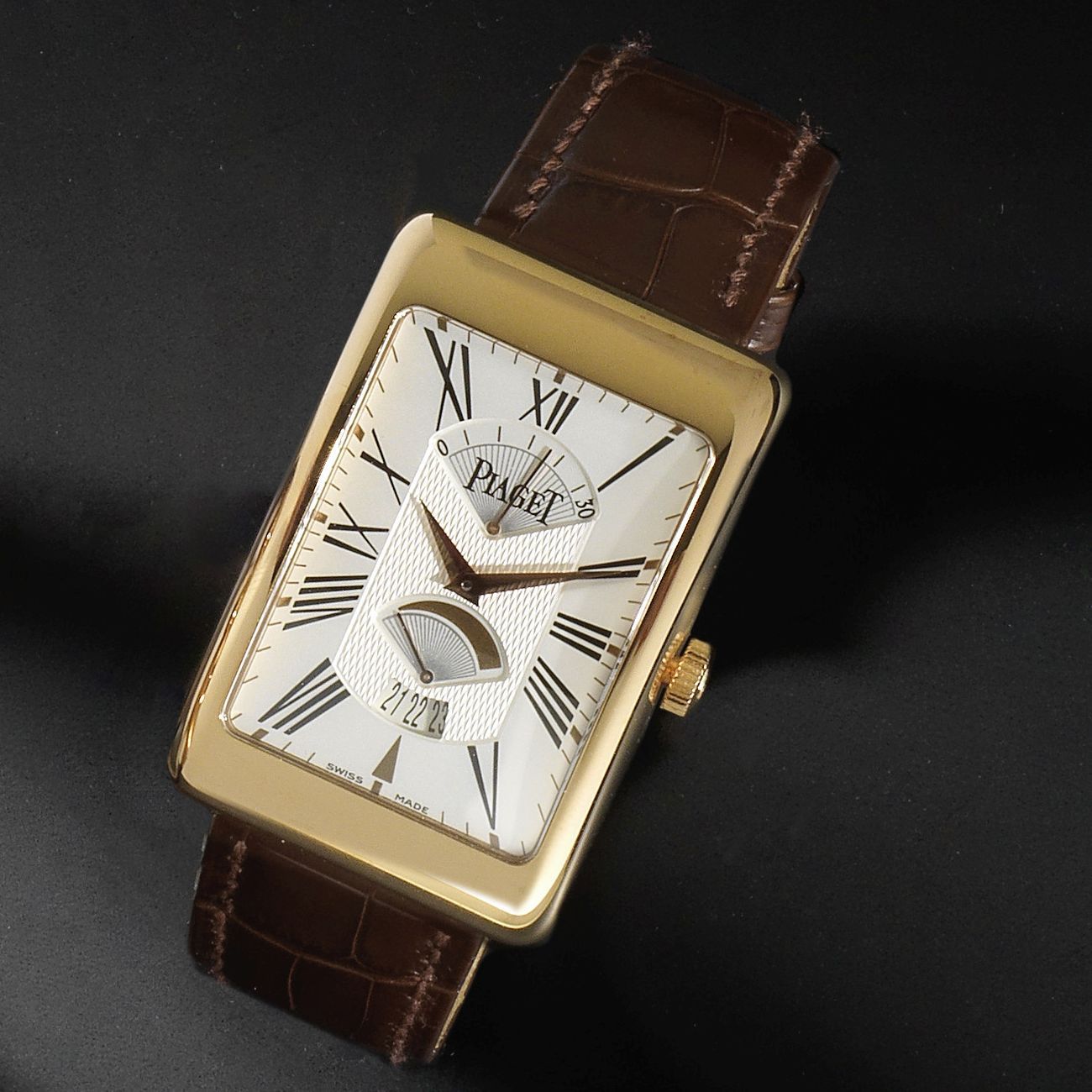 Piaget. An 18K rose gold rectangular automatic calendar wristwatch with power reserve and retrograde seconds Ref:PI0076, Case No.934608, Sold 28th September 2005
