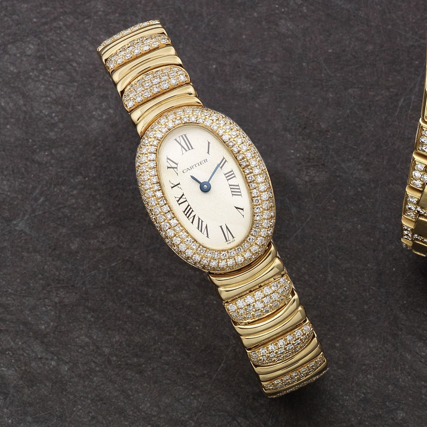 Cartier. A lady's 18K gold and diamond set quartz oval bracelet watch Baignoire, Ref:1960, Case No.GC10494, Circa 1995