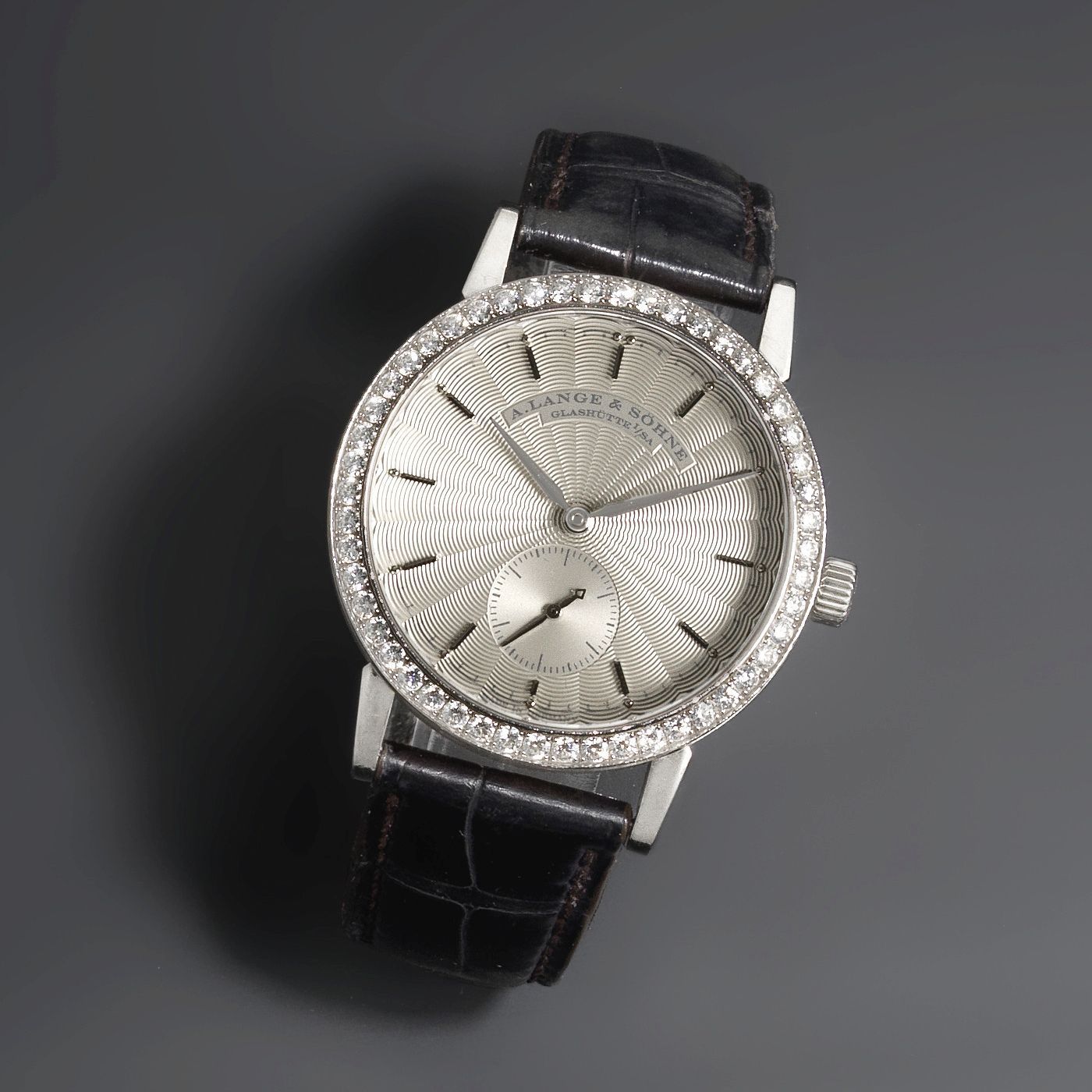 A. Lange & Söhne. An 18K white gold and diamond set manual wind wristwatch Little Saxonia, Ref:198267, Movement No.81167, Sold 9th May 2012