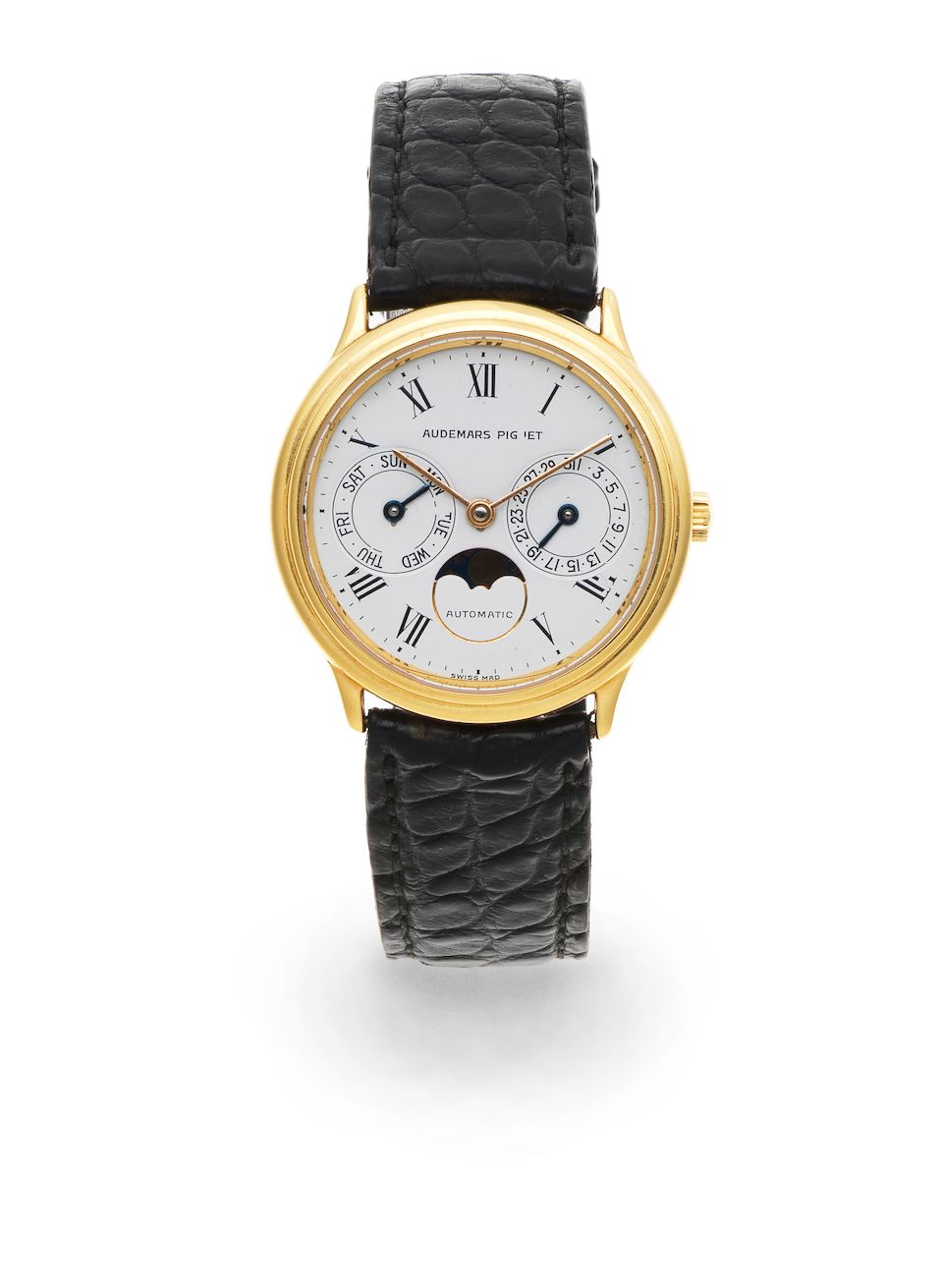 Audemars Piguet. An 18K gold automatic calendar wristwatch with moon phase Circa 1990
