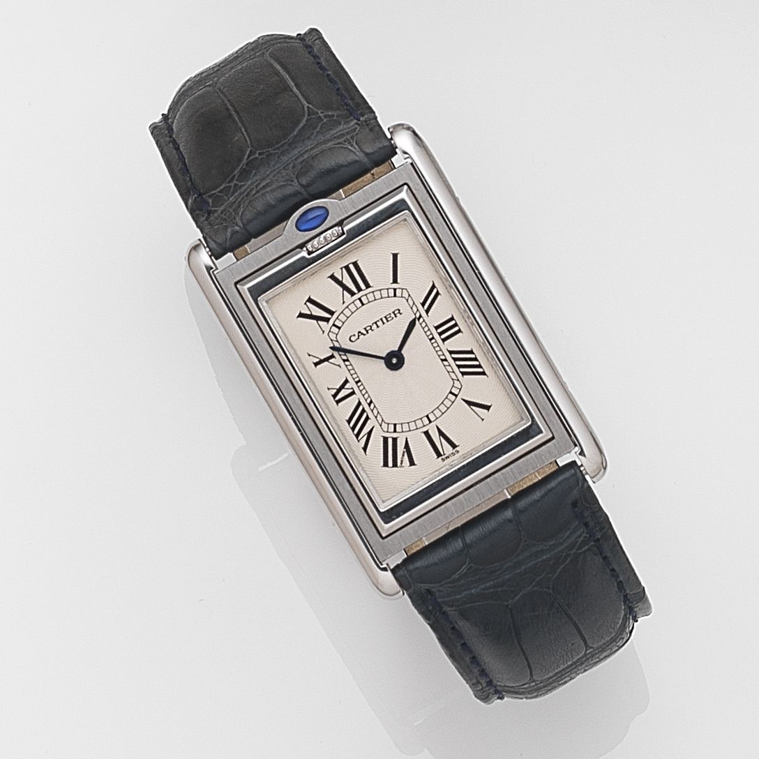Cartier. A stainless steel manual wind reversible wristwatch Tank Basculante, Ref:2390, Case No.55507PB, Sold 21st December 2001