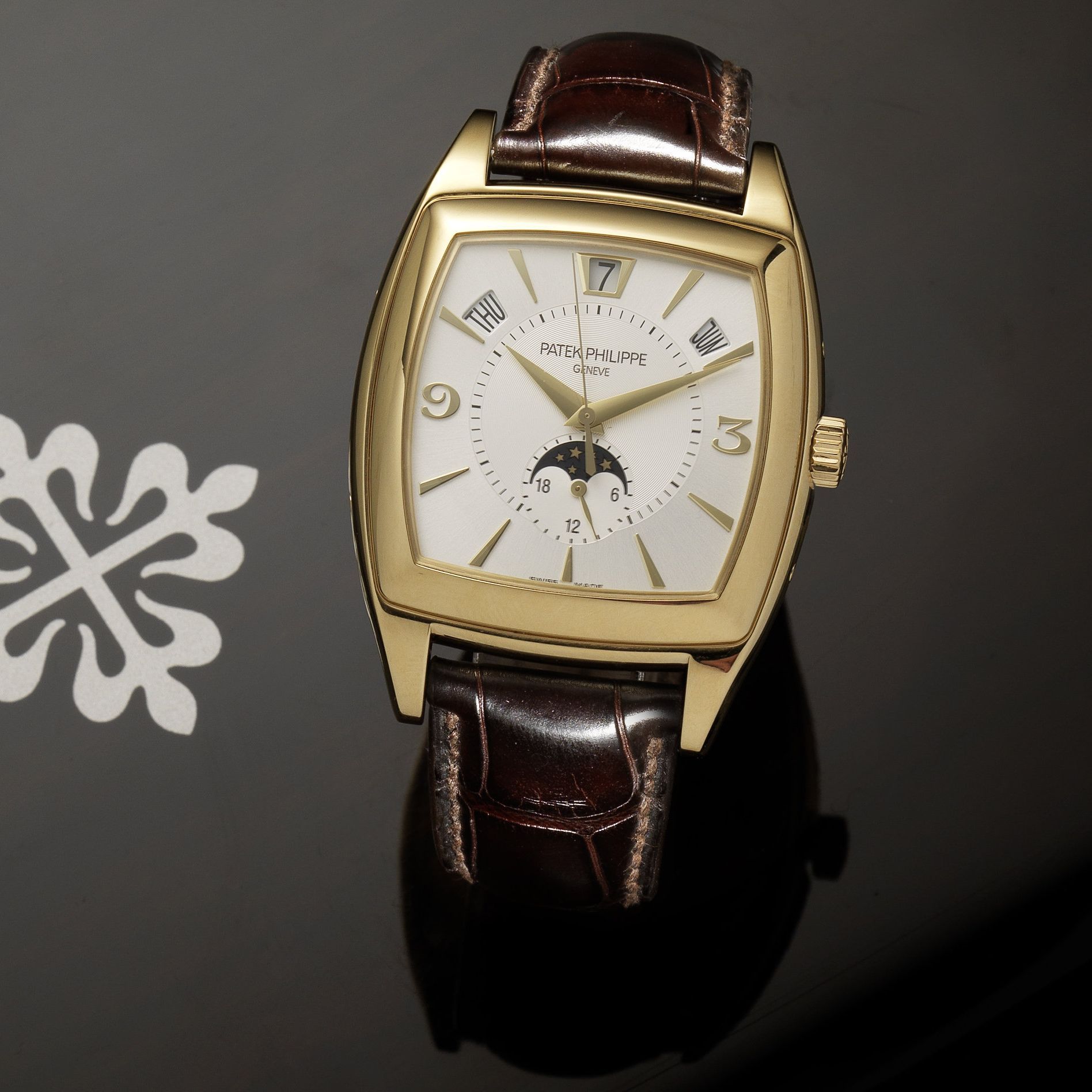 Patek Philippe. A fine 18ct gold automatic centre seconds wristwatch with annual calendar, moon phase and 24-hour indication Gondolo, Ref:5135J, Case No.4434028, Movement No.3651345, Sold ...