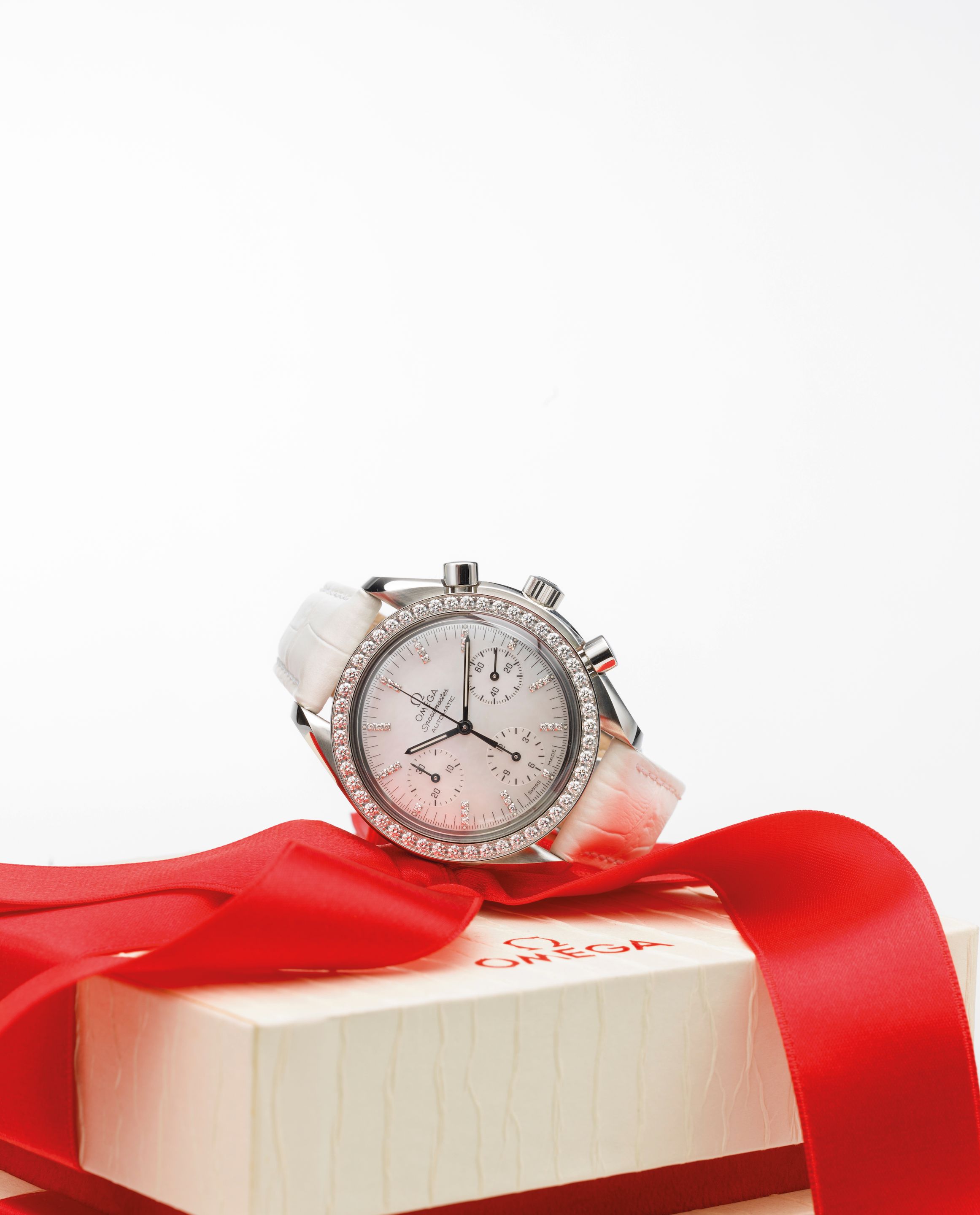 Omega. A lady's stainless steel, mother-of-pearl and diamond set automatic chronograph wristwatch with box and papers Speedmaster Automatic, Ref:275.0032, Case No.90242185, Circa 2005