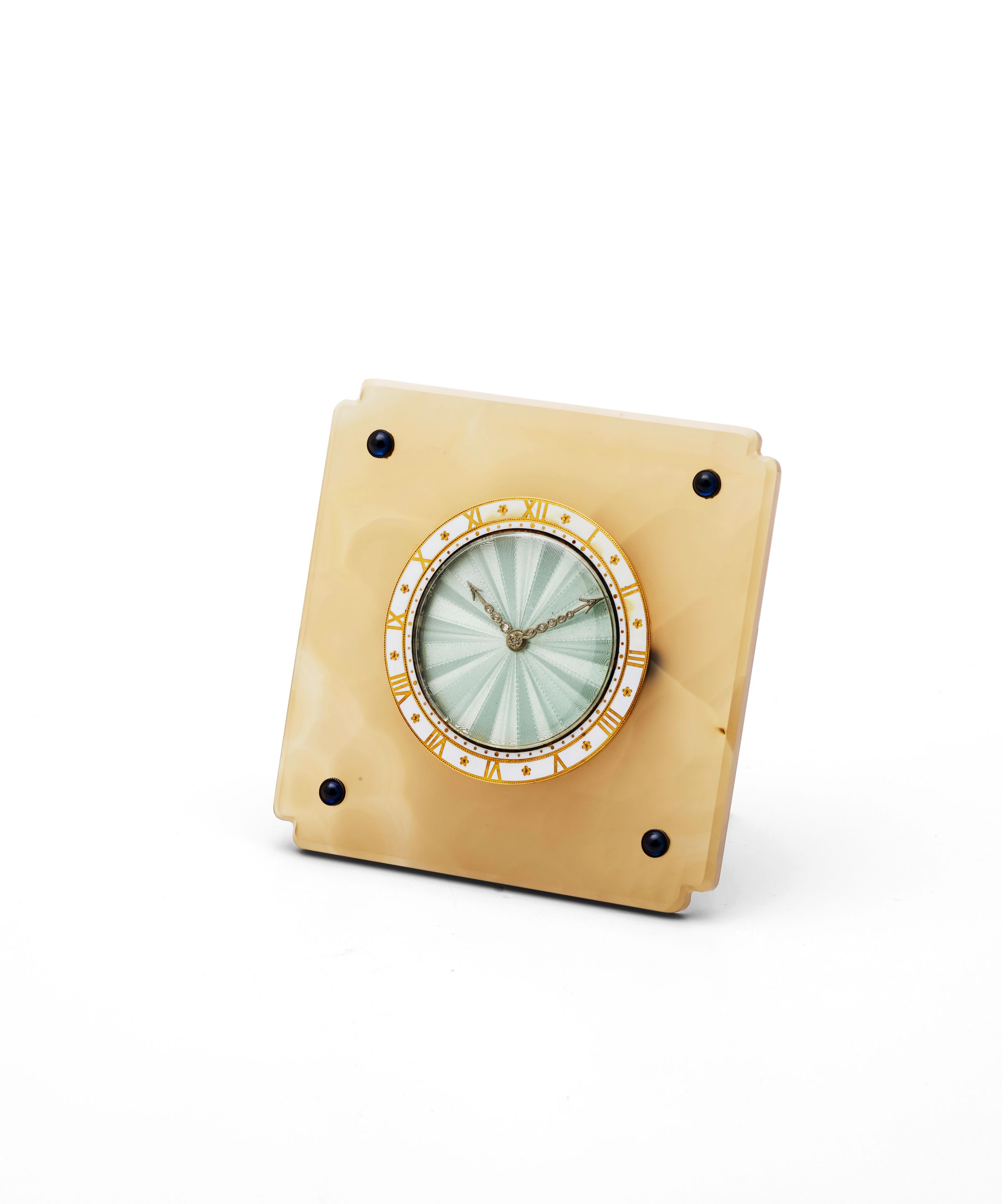 Cartier. An early 20th century agate desk timepiece with sapphire and enamel decoration Circa 1920