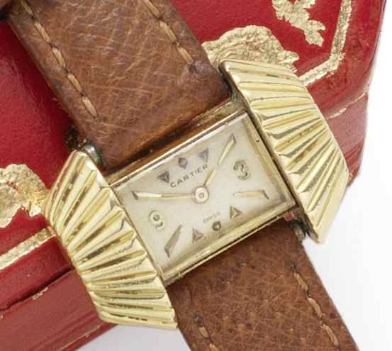 Cartier. A lady's 18ct gold back-winding 'sunburst' wristwatchCase No.662067, London Import mark for 1955