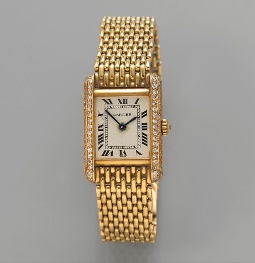 Cartier. A gold and diamond lady's quartz Tank bracelet watchcase no. 66120352