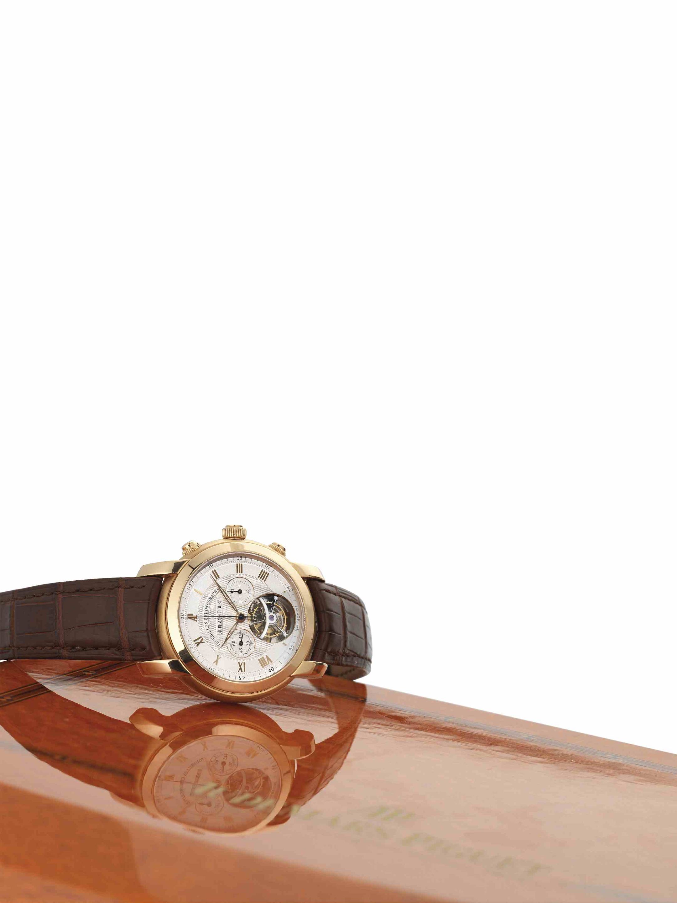 Audemars Piguet. A very rare and important 18ct rose gold tourbillon chronograph manual wind wristwatchJules Audemars - Tourbillon Chronographe, Ref:26010, Case No.F94126, Movement No.678160, Sold ...