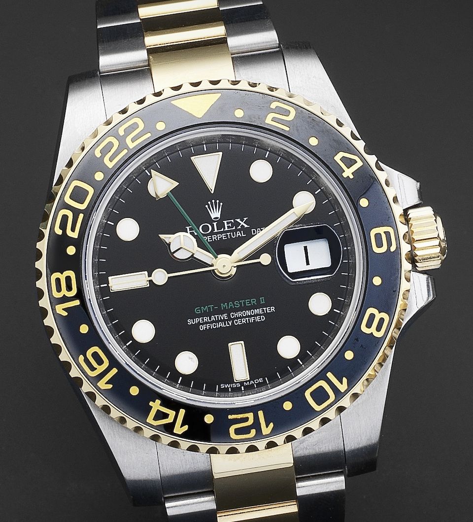 Rolex. A fine steel and gold automatic calendar bracelet watch with dual time zone indicationGMT-Master Ref:116713, Serial No.V011***, Circa 2008