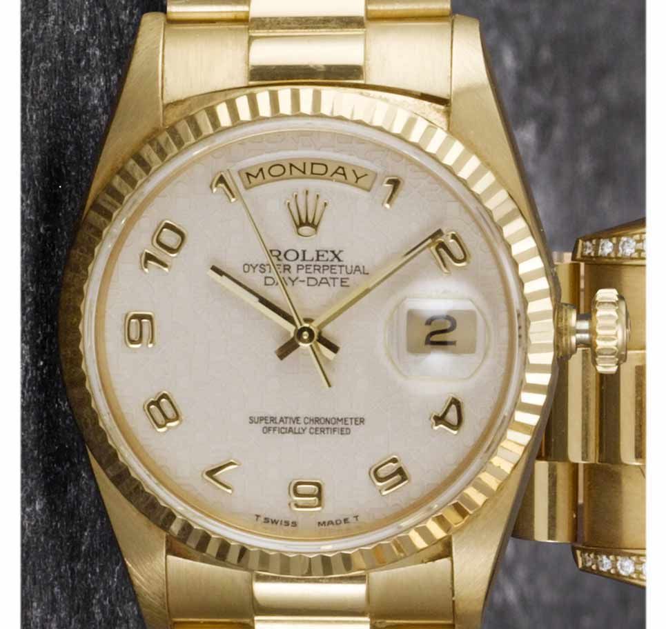 Rolex. A fine 18ct gold centre seconds calendar bracelet watchDay-Date, Sold in 1993