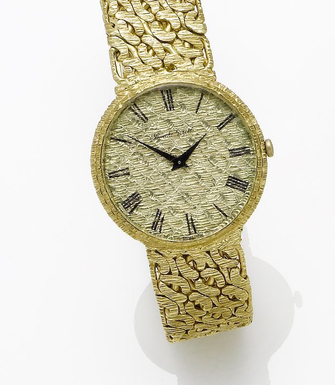Bueche Girod. An 18ct gold manual wind bracelet watchLondon import mark for 1962