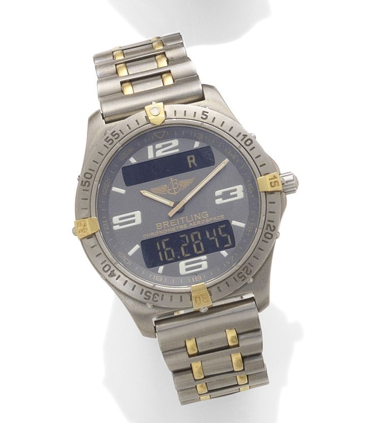 Breitling. A titanium and gold quartz wristwatch with digital displayAerospace, reference F75362M, case number 594423