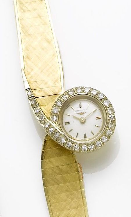 Longines. An asymmetrical lady's 18ct diamond set bracelet watch1960's