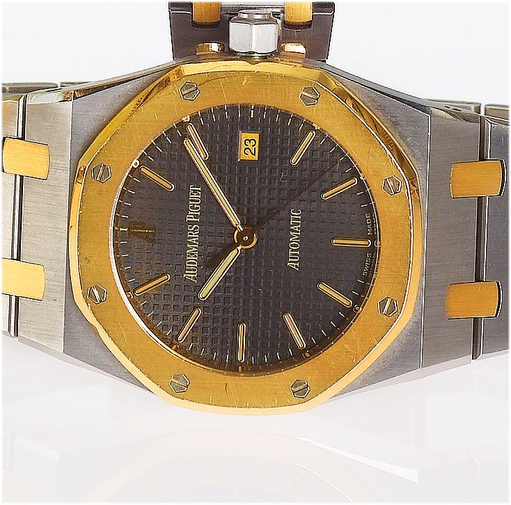 Audemars Piguet. A steel and gold automatic centre seconds calendar watchRoyal Oak, No.385, Sold in 1997