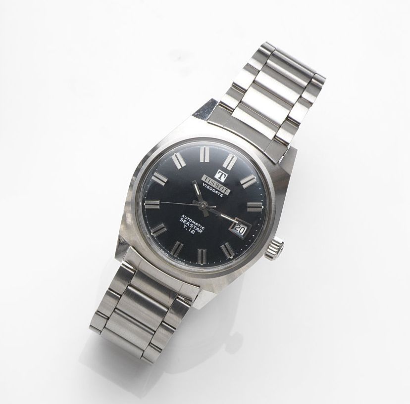 Tissot. A stainless steel automatic calendar bracelet watchVisodate Automatic Seastar T-12, Ref:2-44942, Movement No.1422619, Sold 10th November 1987