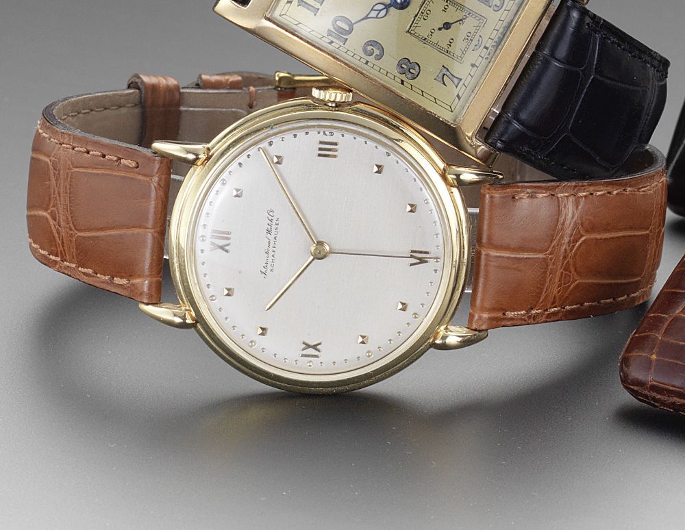 IWC. An 18ct gold manual wind centre seconds wristwatch1950's