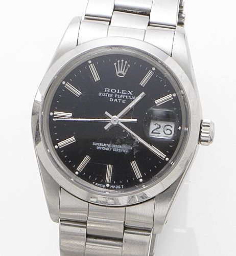 Rolex. A stainless steel calendar bracelet watch together with box and papersDate, Ref:15000, Serial No. R504701, Sold 1988