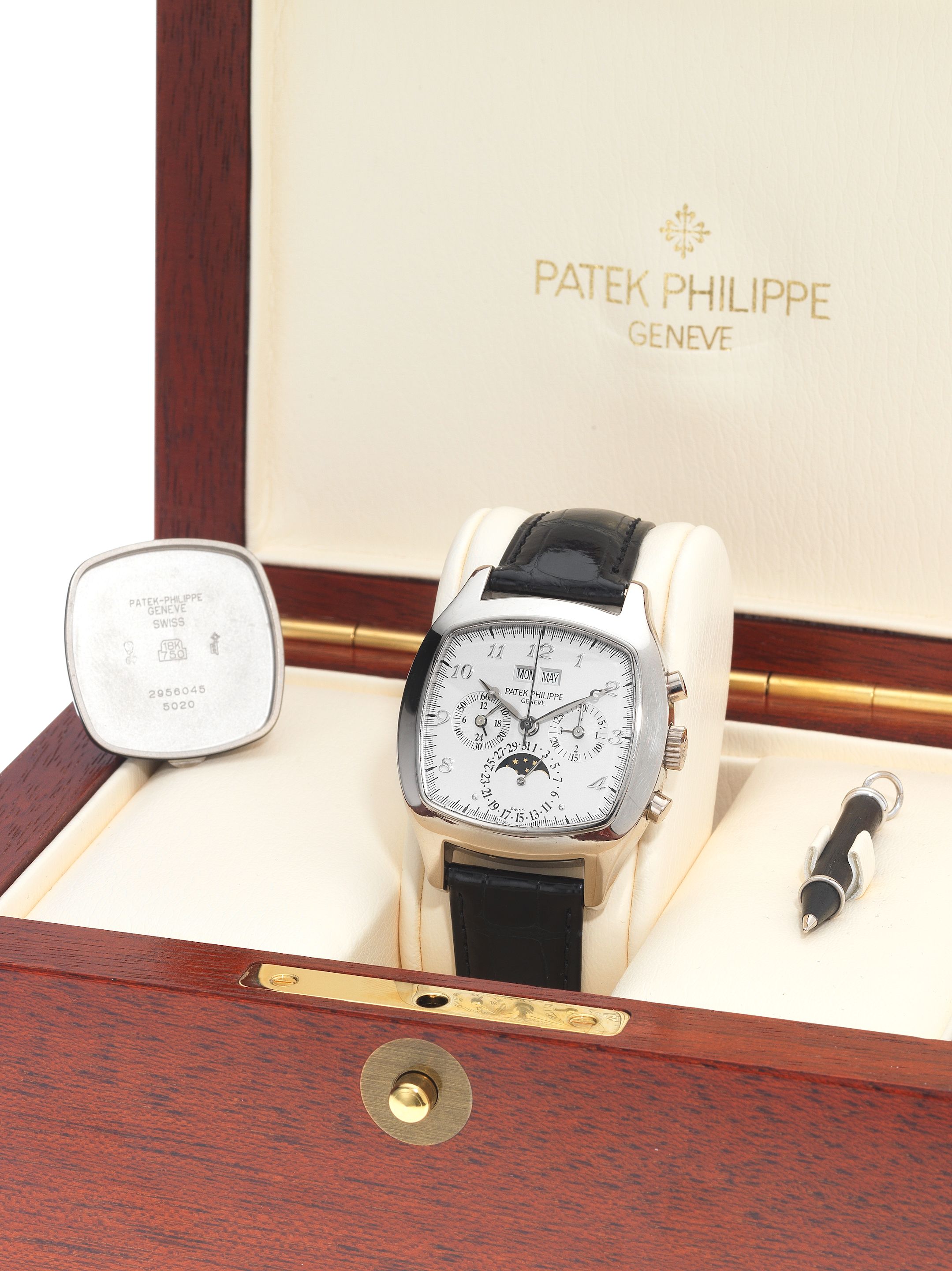 Patek Philippe. A fine and rare 18ct white gold perpetual calendar chronograph wristwatch with moonphase, together with a fitted box, setting pin and spare solid ...