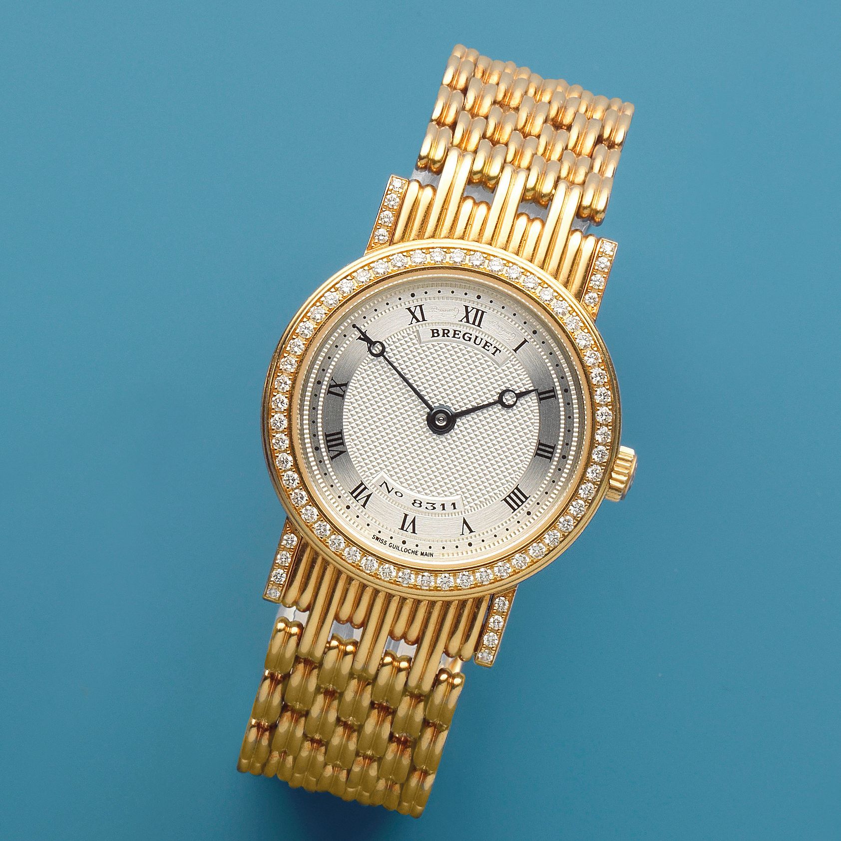 Breguet. A lady's 18K gold and diamond set manual wind bracelet watch Classique, Ref: 8561, Circa 2000