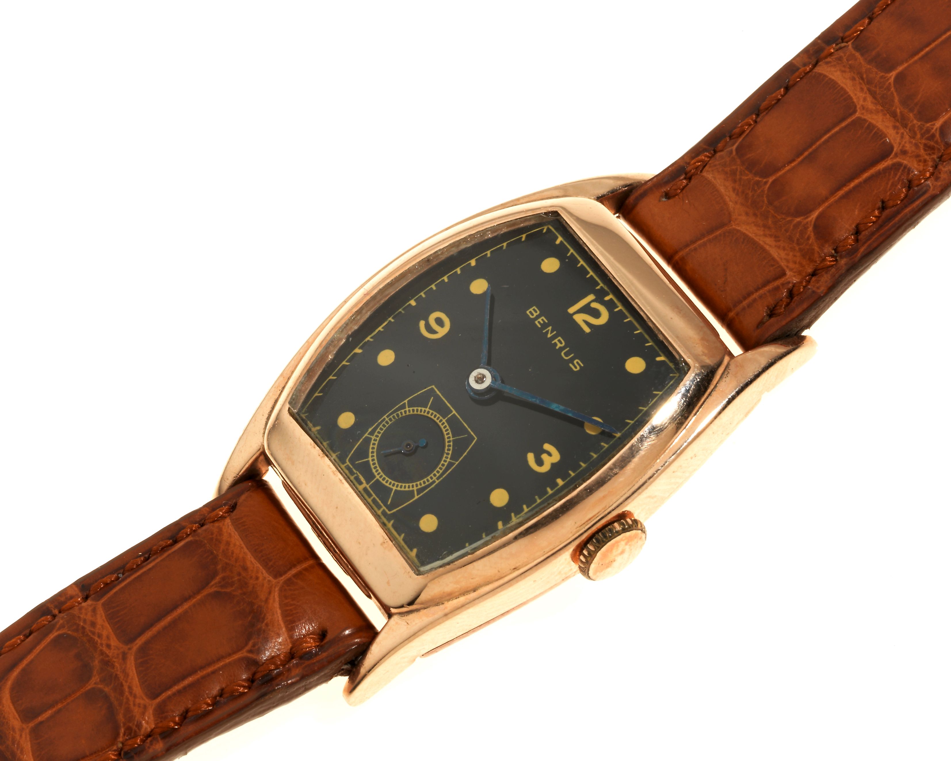 Benrus. A gold plated manual wind tonneau form wristwatch