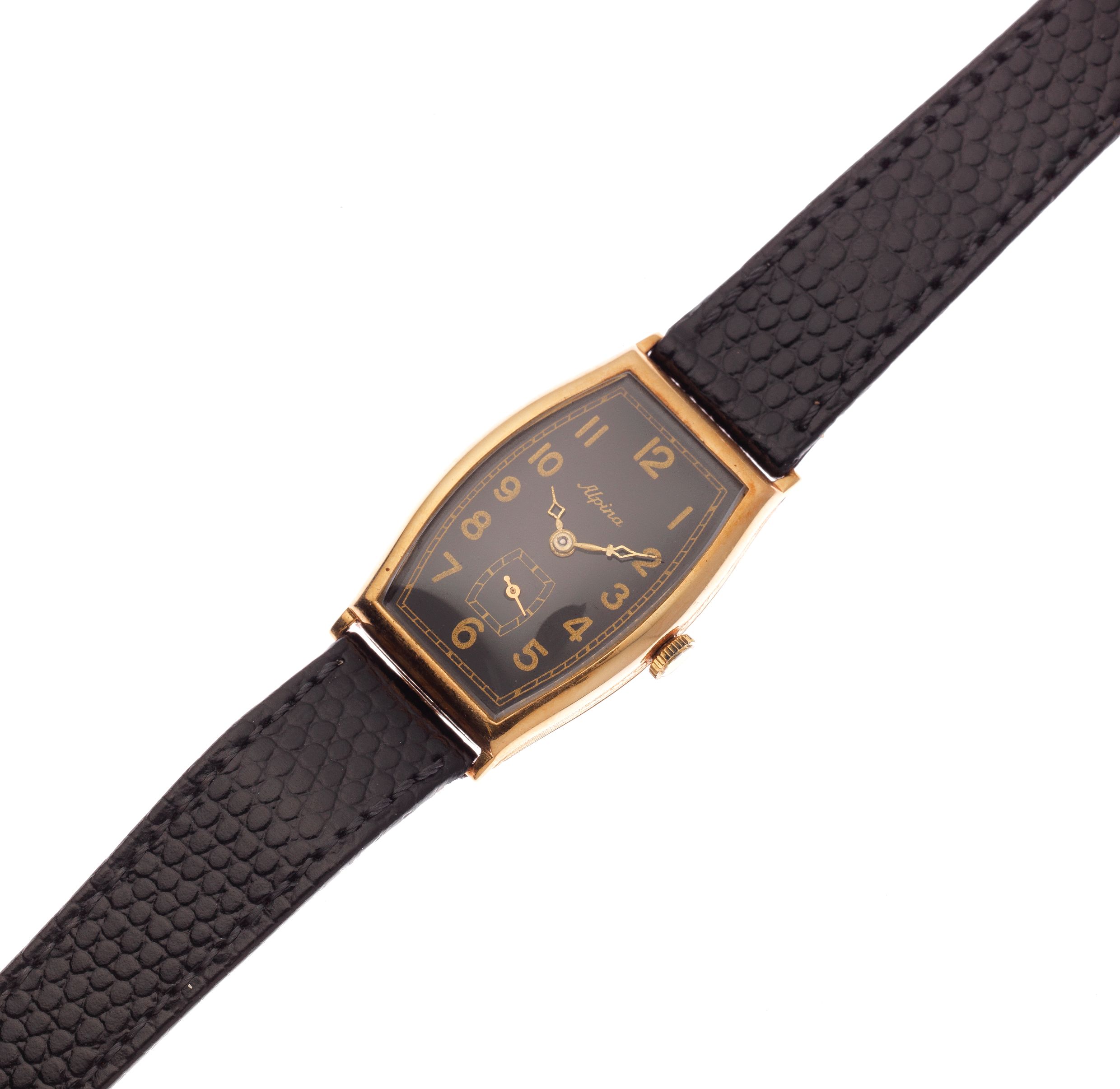 Alpina. A lady's 14K gold manual wind tonneau form wristwatch Circa 1930