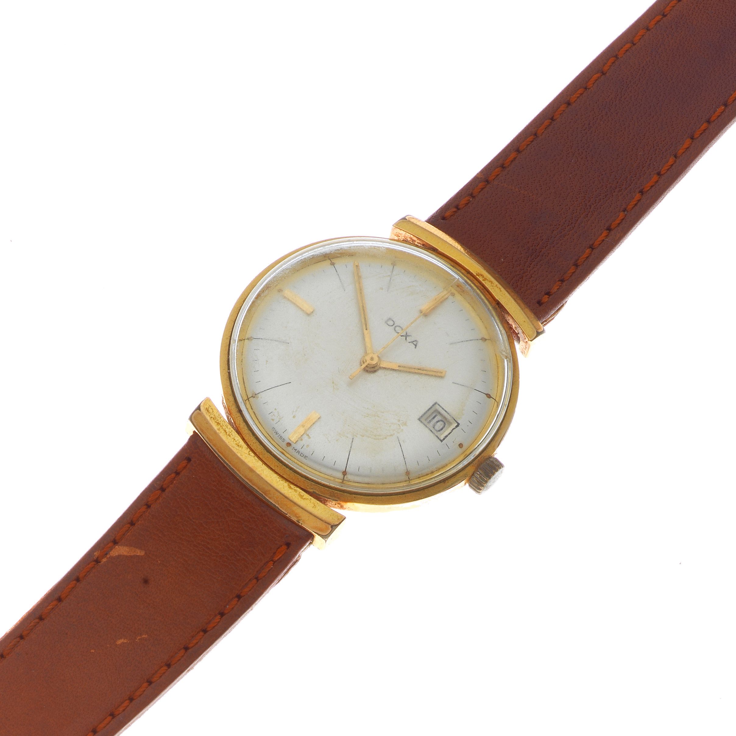 Doxa. A gold plated and steel manual wind calendar wristwatch Ref: 104587, Circa 1950