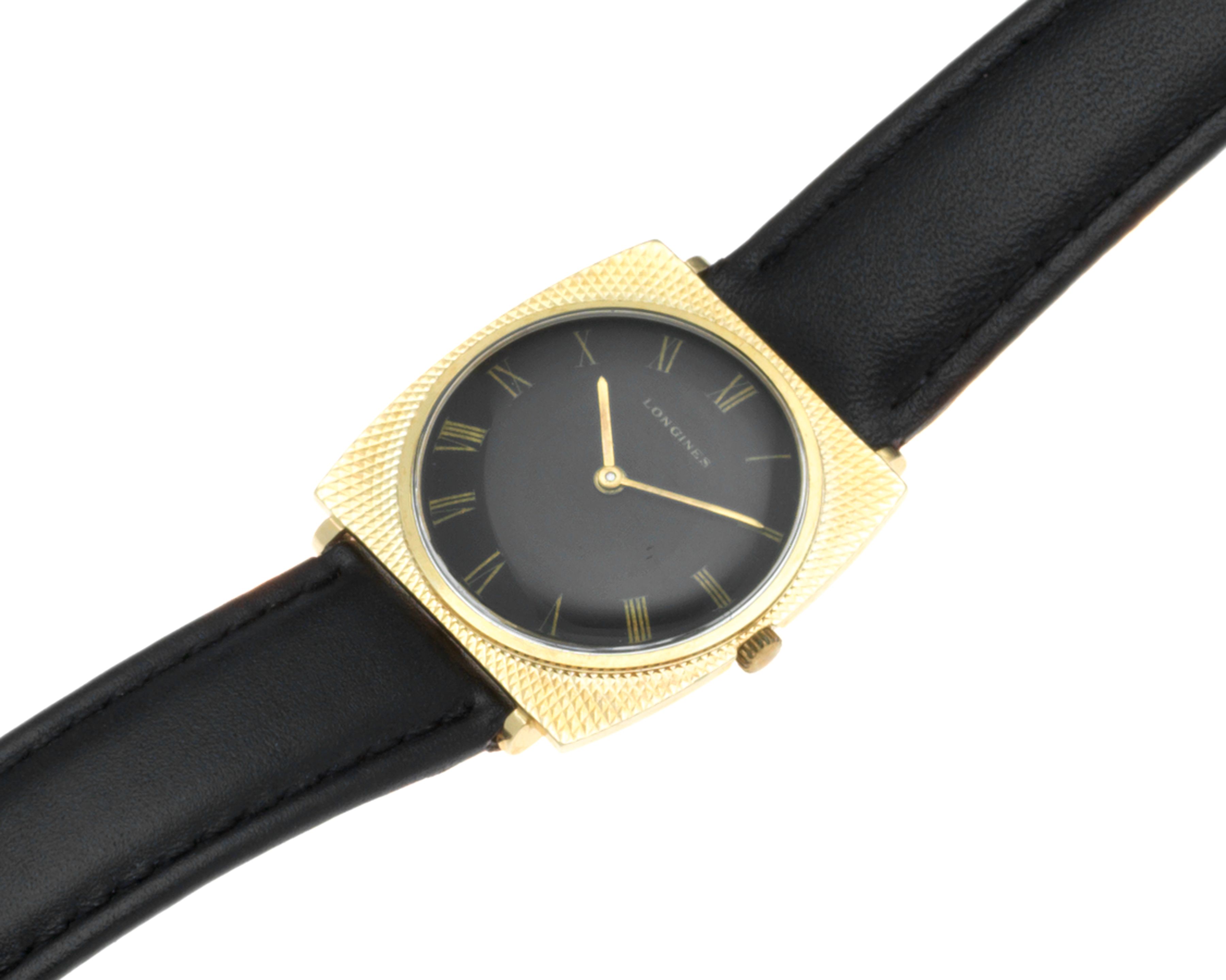 Longines. A 14K gold manual wind wristwatch