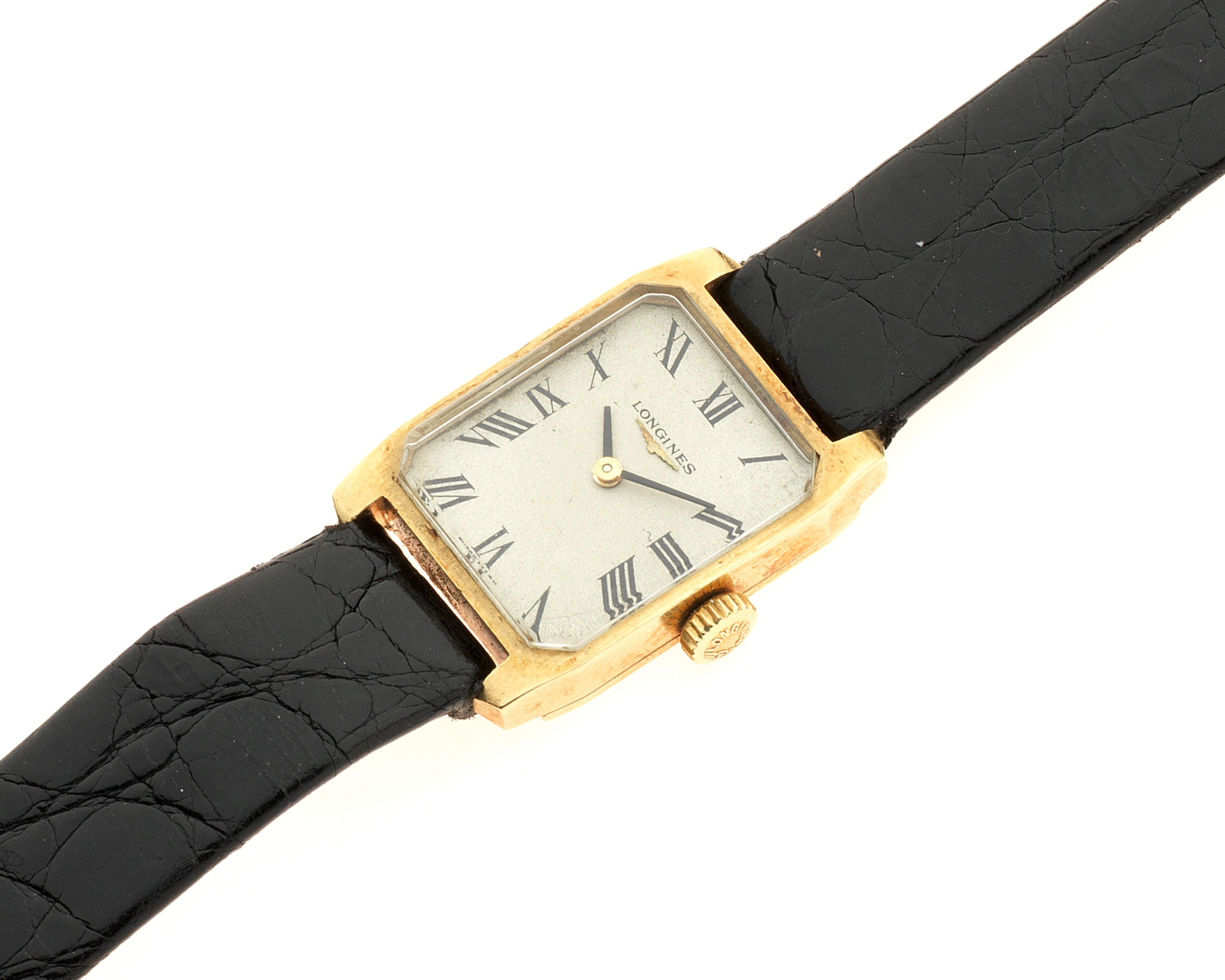 Longines. A lady's 18K gold manual wind rectangular wristwatch