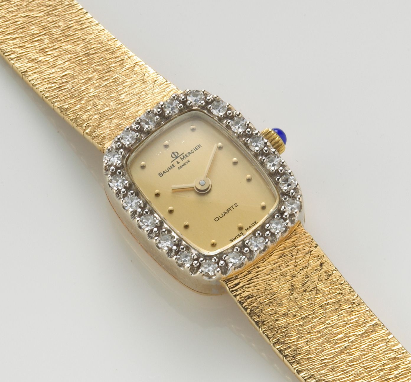 A diamond and fourteen karat bicolor gold wristwatch, Baume & Mercier