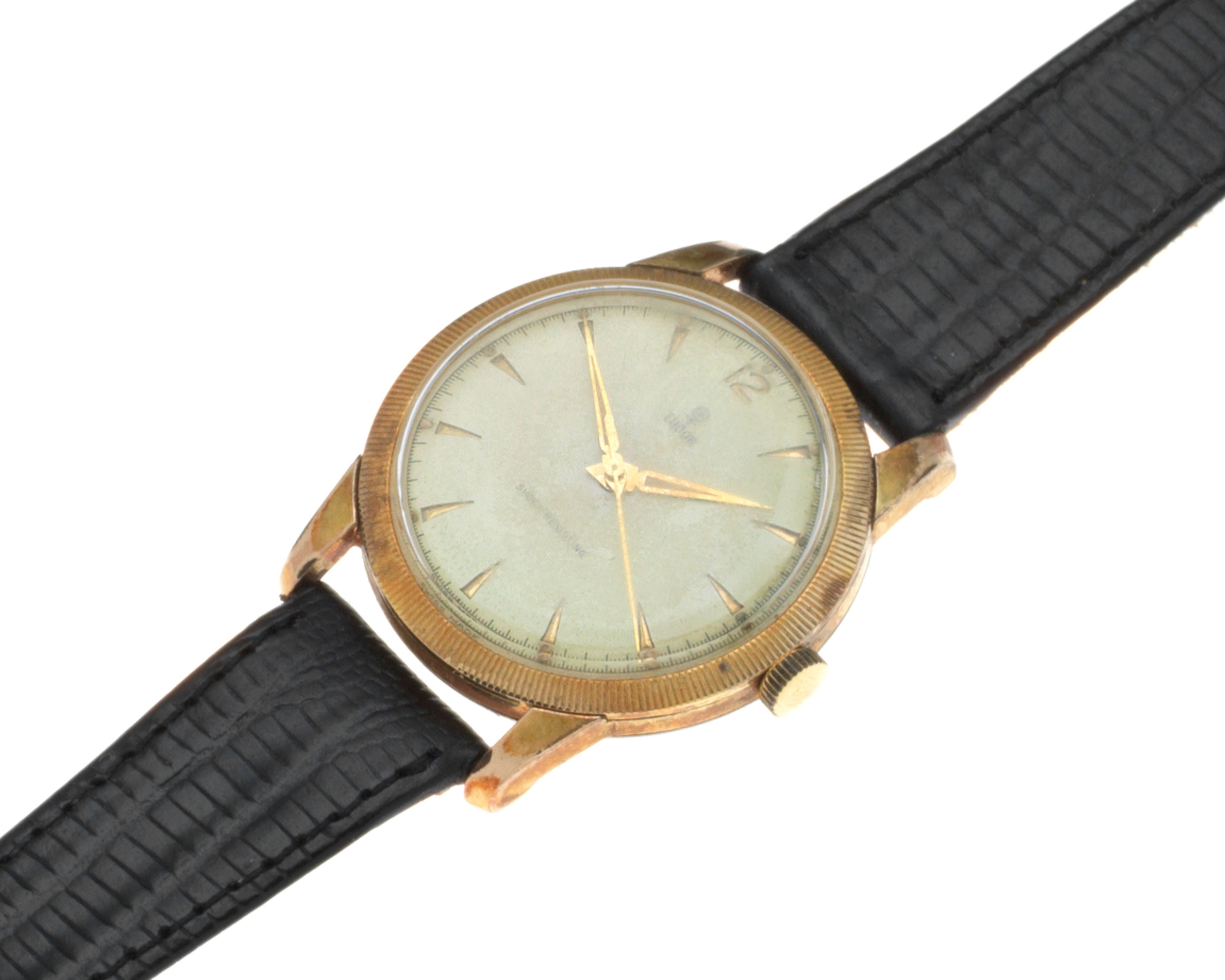 Tudor. A gold plated and stainless steel manual wind wristwatch
