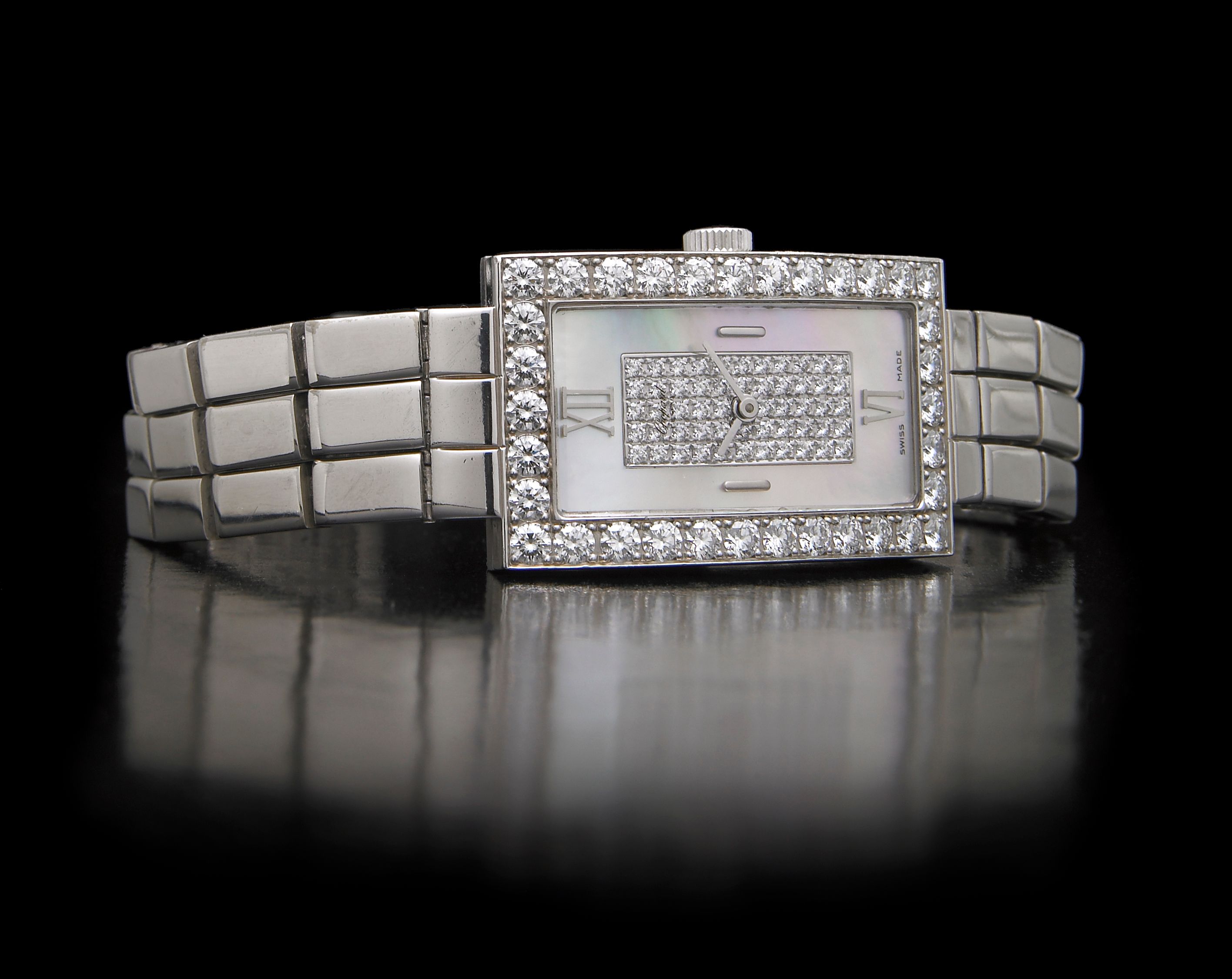 Chopard. A lady's 18k white gold and diamond set quartz bracelet watch with diamond set mother of pearl dialRef.488-1, 1990s