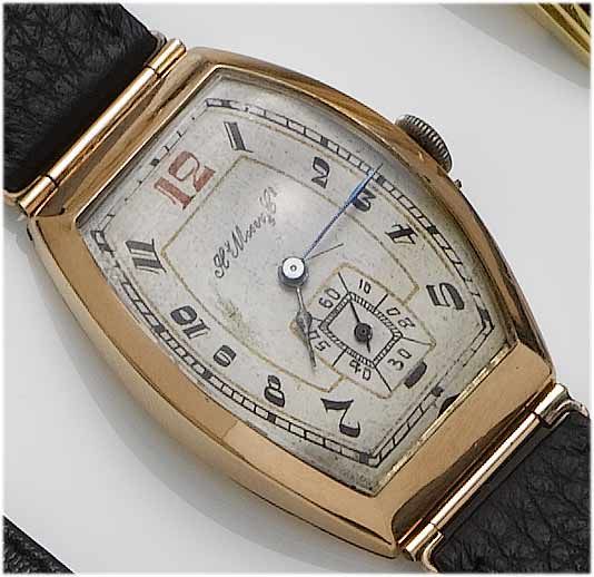 Henry Moser. A 14ct gold gents tonneau cased wristwatch 1935