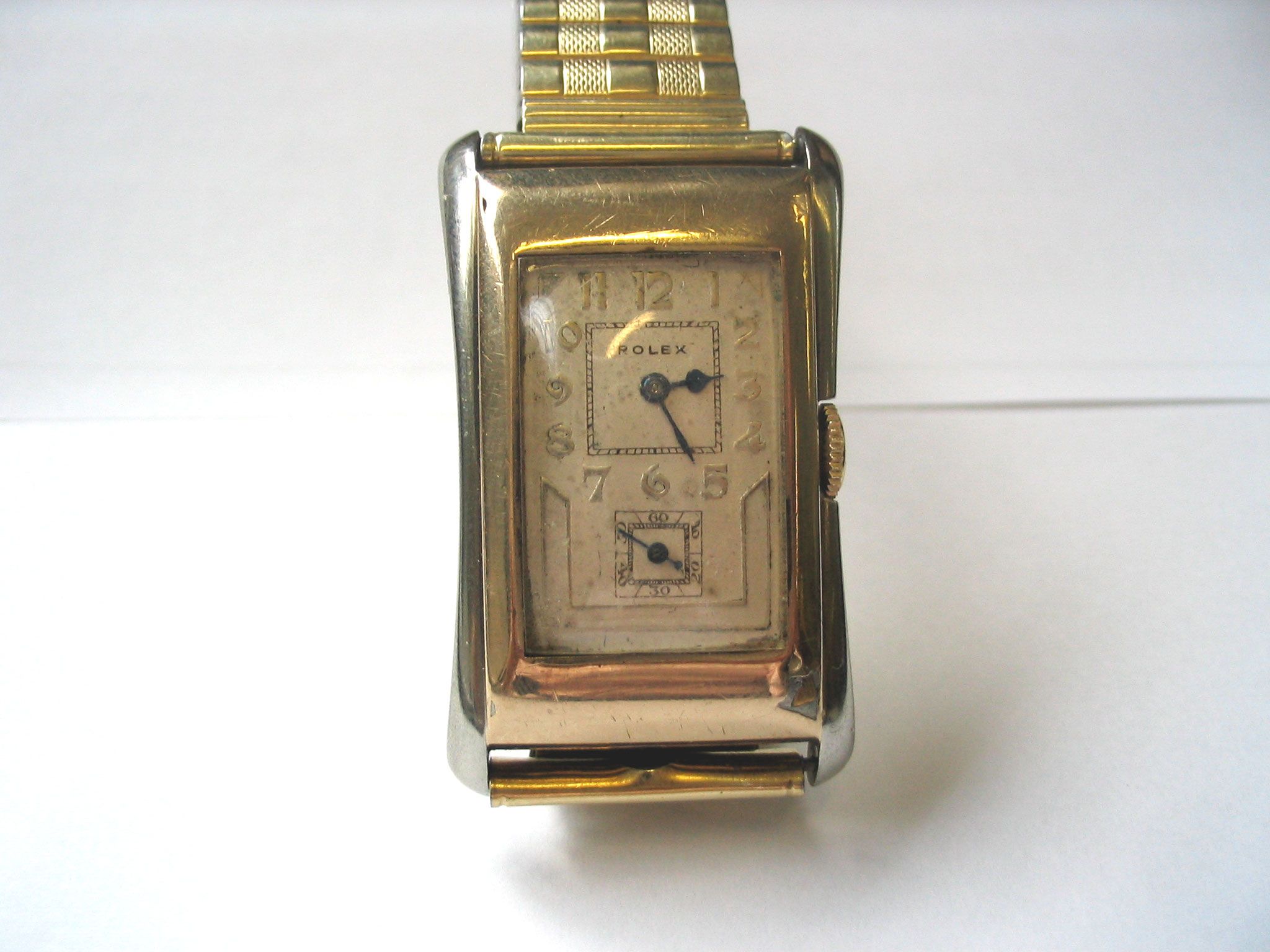 Rolex. A 9ct gold rectangular wristwatch with flared sides Ref:971U, Glasgow Import mark for 1930