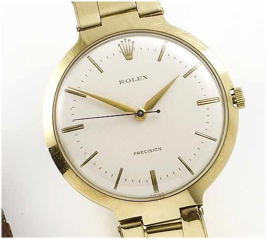 Rolex. An 9ct gold centre seconds bracelet watch1950's