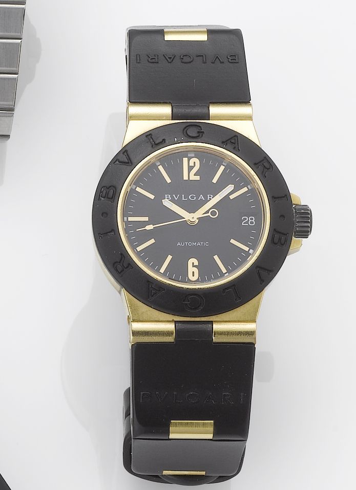 Bulgari. A lady's 18ct gold and titanium automatic centre seconds calendar wristwatchRecent