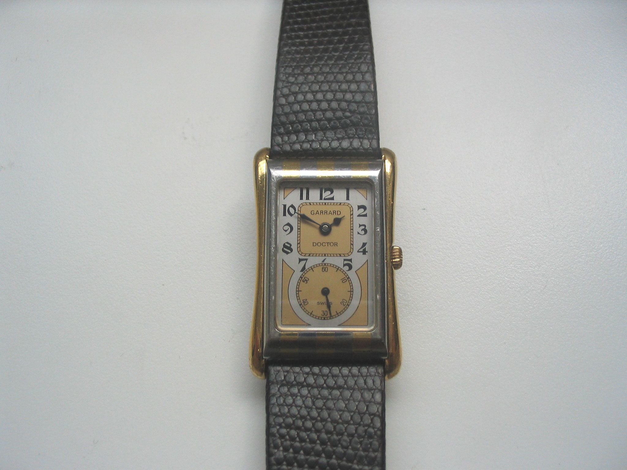 Garrard. A steel and gold quartz wristwatch together with box and papersDoctor, Sold in 1987