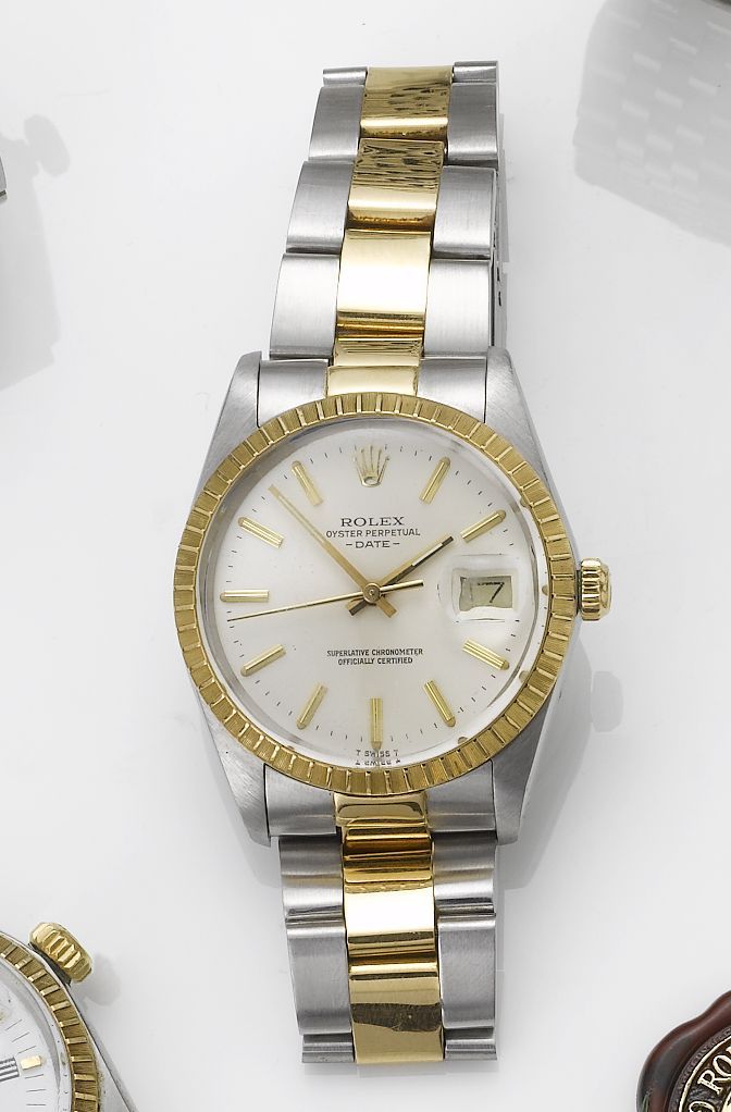 Rolex. A stainless steel and gold automatic centre seconds calendar bracelet watchDate, 1987