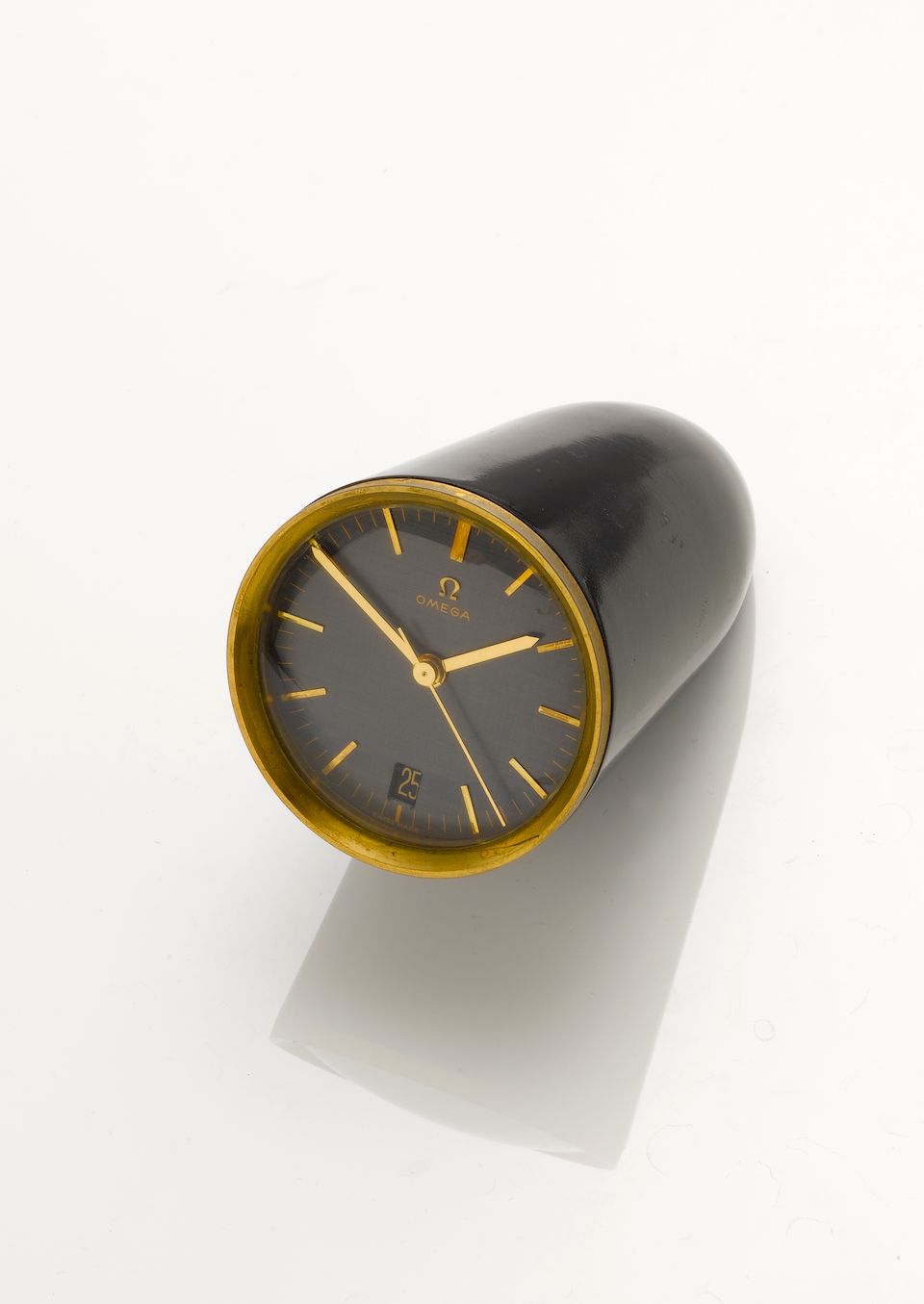 A stylish 1960s desk timepiece with calendar Omega