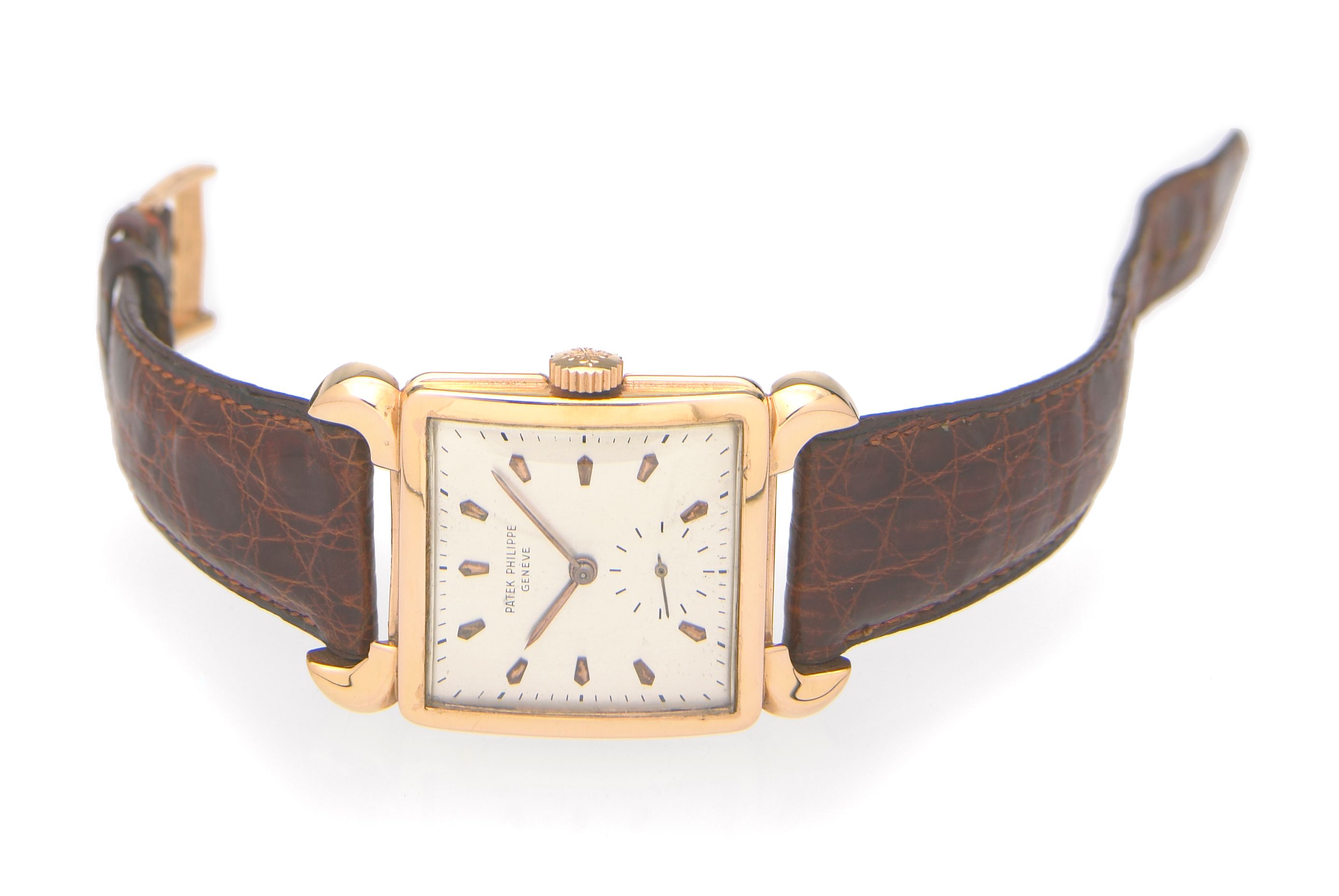 Patek Philippe. A fine and unusual 18k rose gold square wristwatch with horn lugsRef.2423, Case No.652038, Movement No.952286, made in 1949, sold on July 25th ...