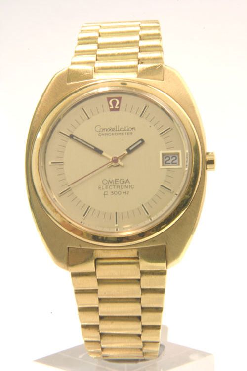 Omega. An 18ct gold centre seconds calendar bracelet watchf300Hz, 1970s
