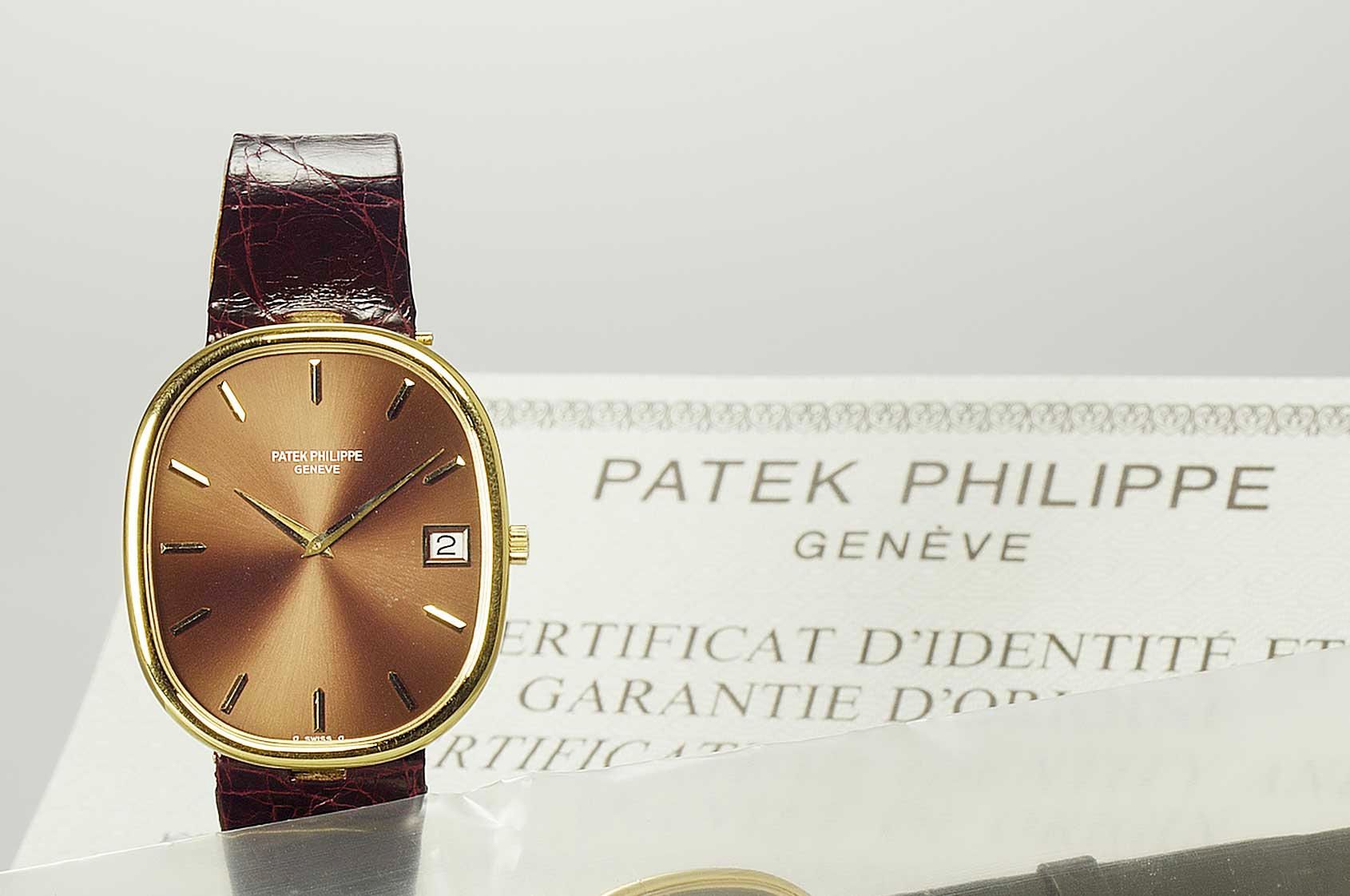Patek Philippe. A fine 18ct gold automatic calendar wristwatch together with certificate and box Ellipse, No.1305427, Ref:3605, Produced in the 1970s, Sold 5th of October ...