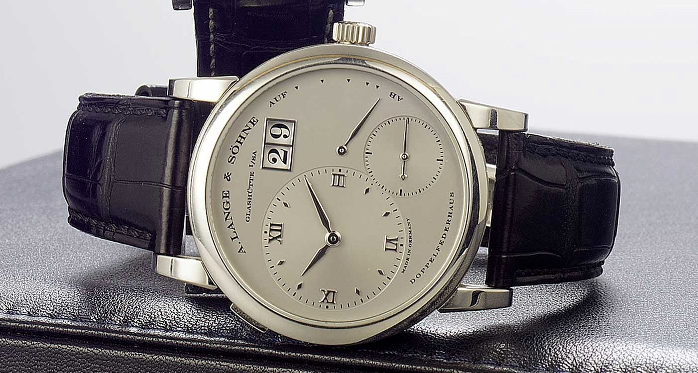 A. Lange & Söhne. A fine platinum wristwatch with oversized date and power-reserve with fitted factory box and papers Lange 1, Ref:101.025. Sold December 2003