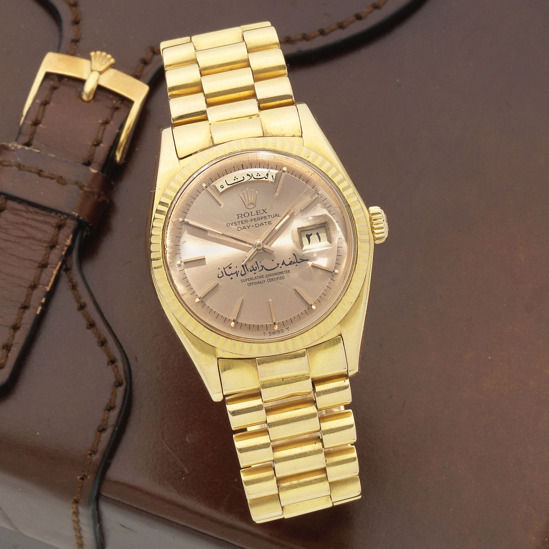Rolex. A fine and rare 18K gold automatic calendar bracelet watch with Arabic dial inscribed 'Khalifa bin Zayed bin Sultan Al Nahyan' and Arabic day ...