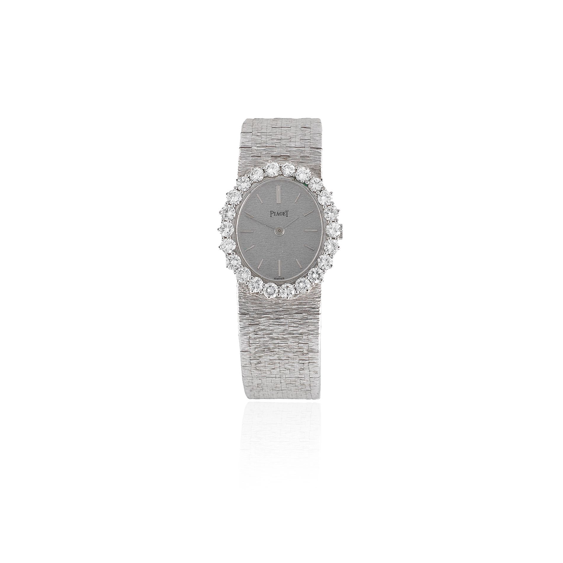 Piaget. A lady's 18K white gold and diamond set manual wind bracelet watch Ref: 9338A6, Circa 1980