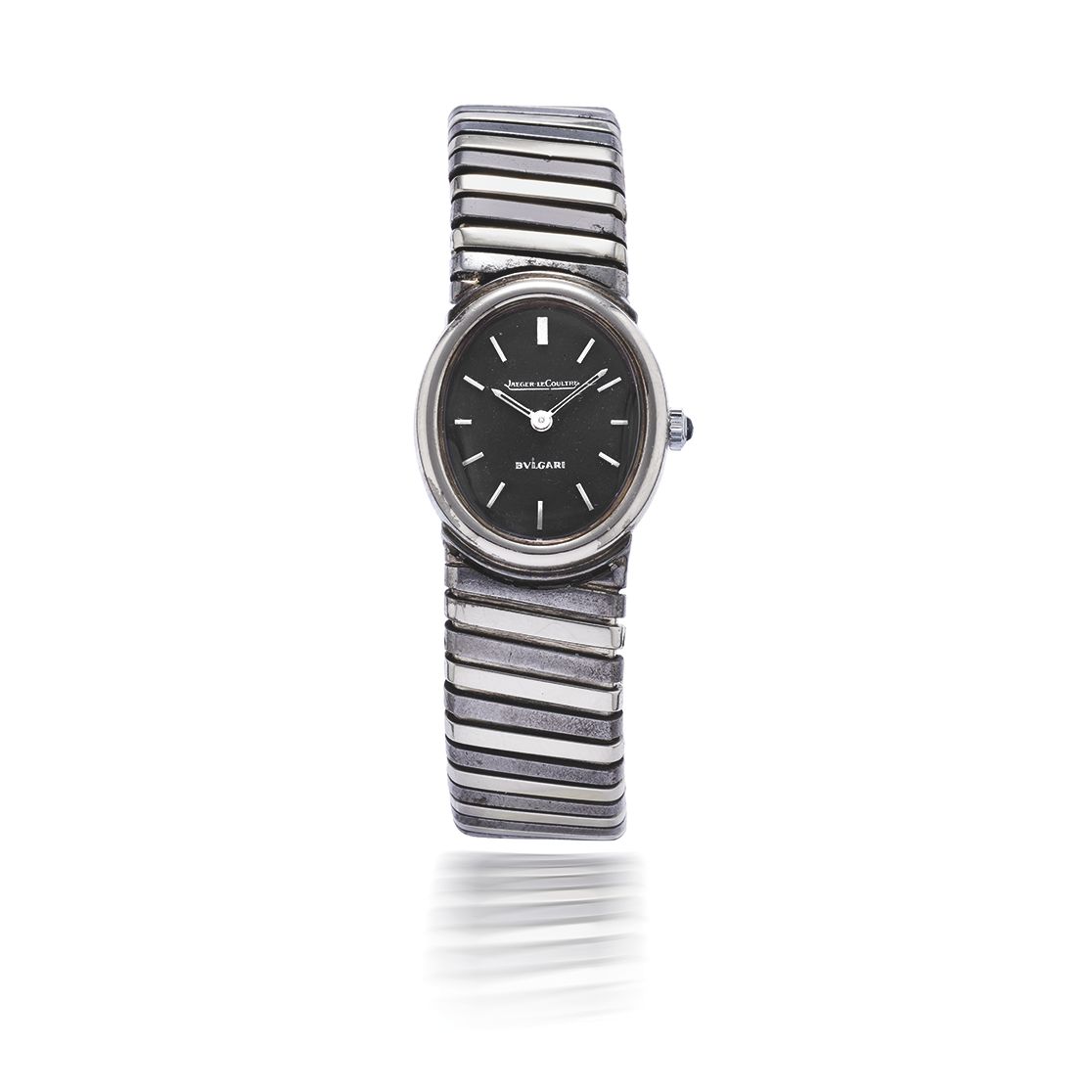 JAEGER-LECOULTRE FOR BULGARI. MONTRE BRACELET MANCHETTE DE DAME EN OR ET ACIER DE FORME OVALE MOUVEMENT MECANIQUE JAEGER-LECOULTRE FOR BULGARI. A LADY'S GOLD AND STEEL ...