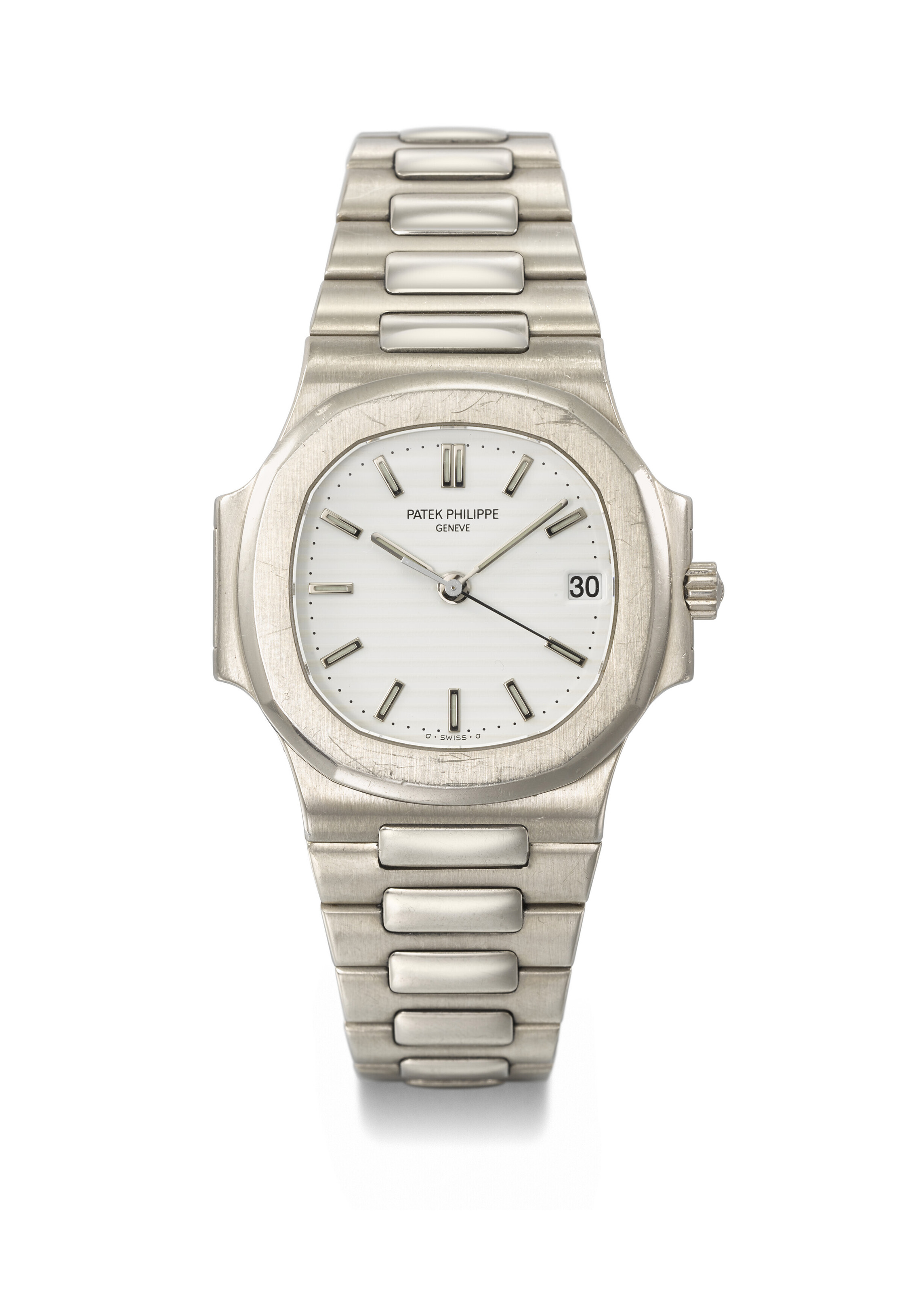 PATEK PHILIPPE. A VERY RARE 18K WHITE GOLD AUTOMATIC WRISTWATCH WITH SWEEP CENTRE SECONDS, DATE AND BRACELET SIGNED PATEK PHILIPPE, GENEVE, NAUTILUS MODEL, REF. 38001, THIRD SERIES, MOVEMENT NO. 3'027'500, CASE NO. 4'066'167, MANUFACTURED IN 1999