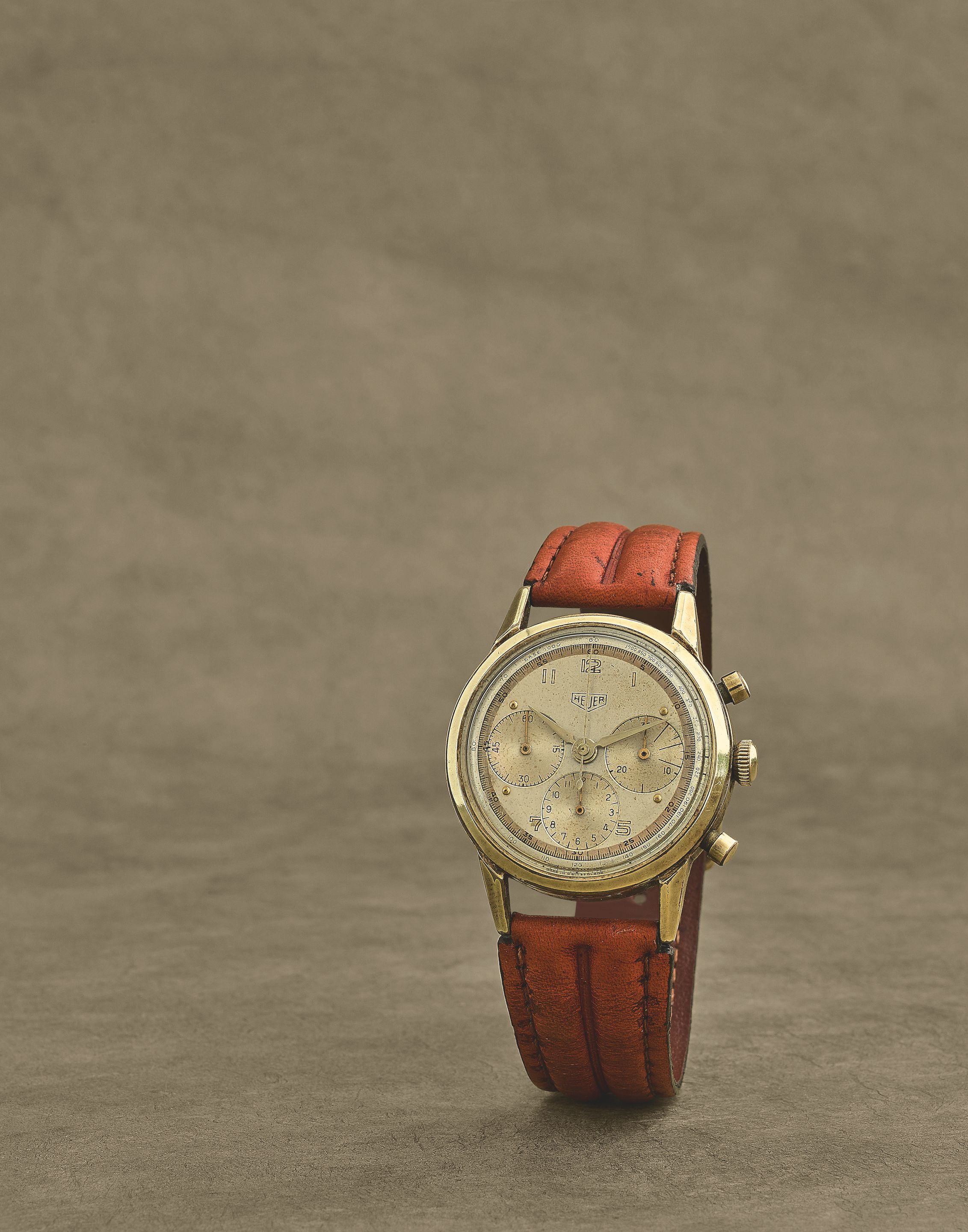 Heuer. Chronographe bracelet en plaqué or et acier mouvement mécanique Heuer. A gold plated and stainless steel manual wind chronograph wristwatch 'Big Eye', Circa 1950