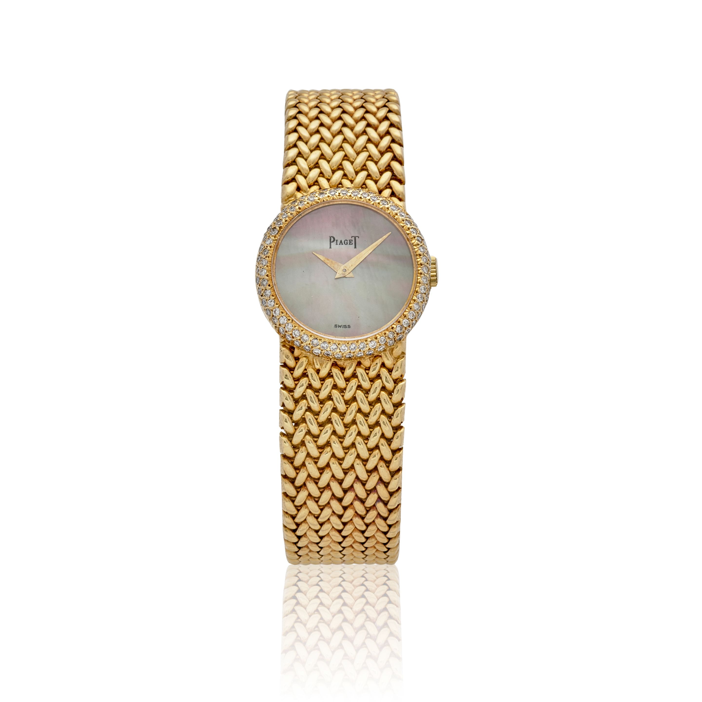 PIAGET. AN 18K GOLD LADY'S MANUAL WIND BRACELET WATCH Protocol,